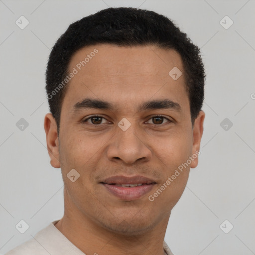 Joyful latino young-adult male with short  brown hair and brown eyes