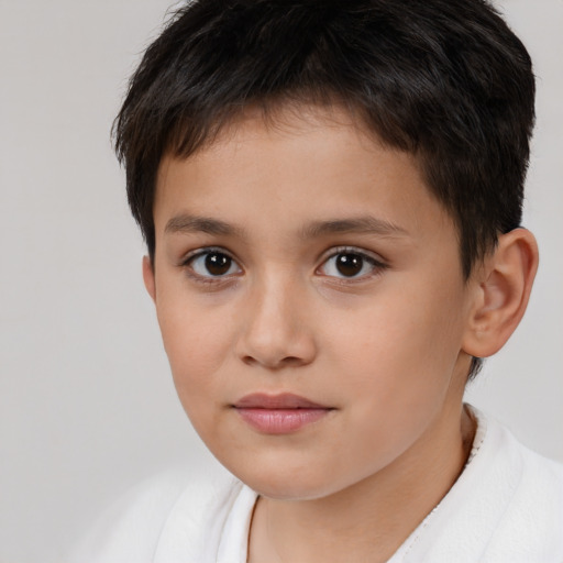 Joyful white child female with short  brown hair and brown eyes