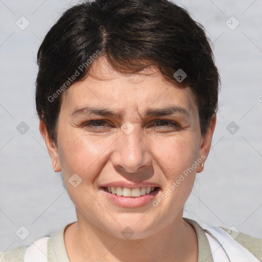 Joyful white adult female with short  brown hair and brown eyes