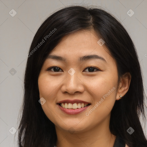 Joyful asian young-adult female with long  brown hair and brown eyes