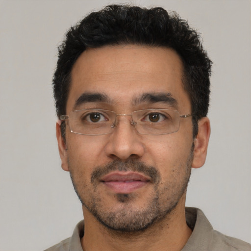 Neutral latino adult male with short  black hair and brown eyes