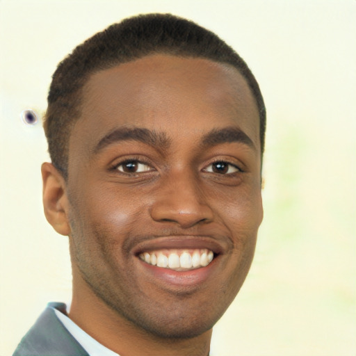 Joyful black young-adult male with short  brown hair and brown eyes