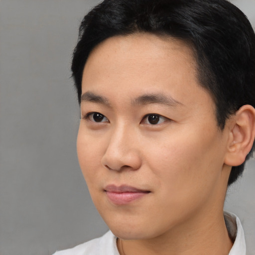 Neutral asian young-adult male with short  black hair and brown eyes