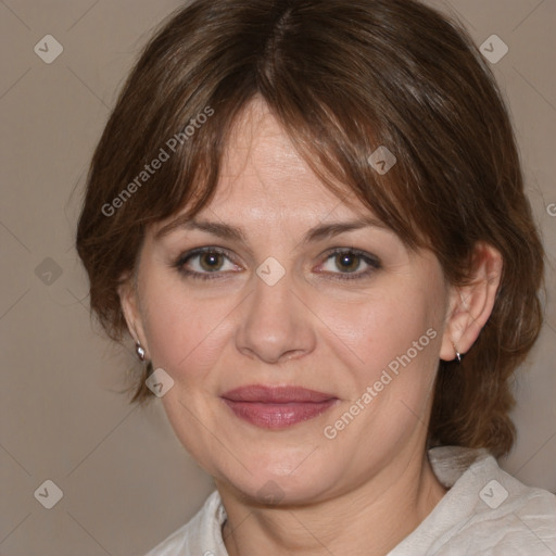 Joyful white adult female with medium  brown hair and brown eyes