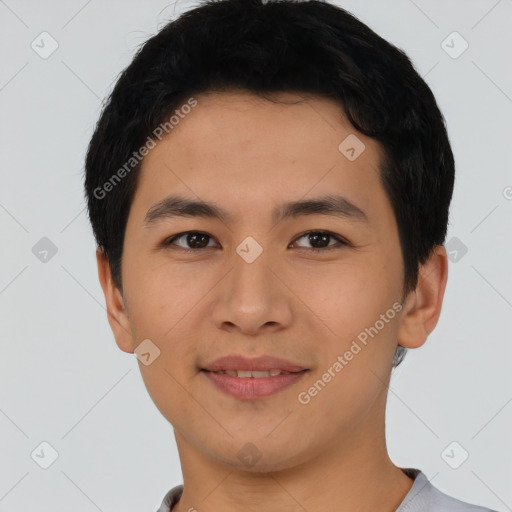 Joyful asian young-adult male with short  black hair and brown eyes