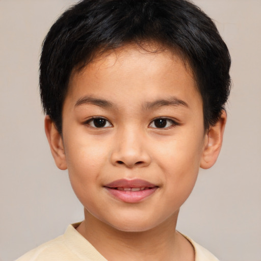 Joyful asian child female with short  brown hair and brown eyes