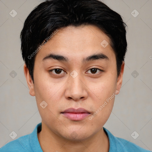 Joyful asian young-adult male with short  black hair and brown eyes