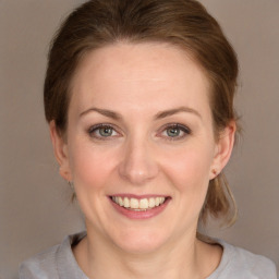 Joyful white young-adult female with medium  brown hair and grey eyes