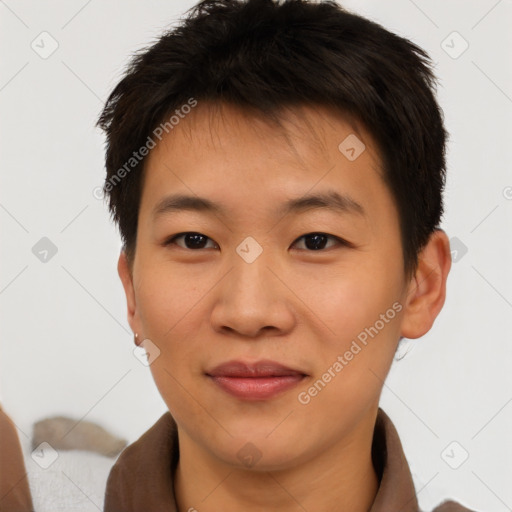 Joyful asian young-adult male with short  brown hair and brown eyes