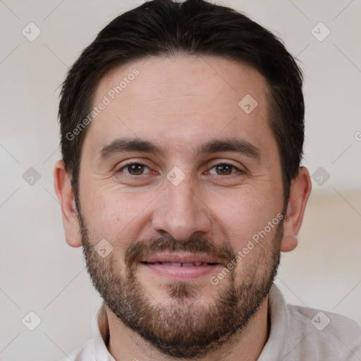 Joyful white adult male with short  brown hair and brown eyes