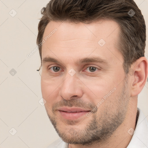 Joyful white adult male with short  brown hair and brown eyes