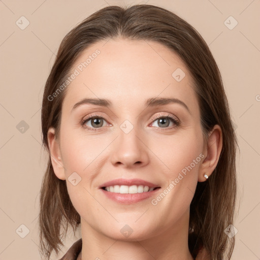 Joyful white young-adult female with long  brown hair and grey eyes