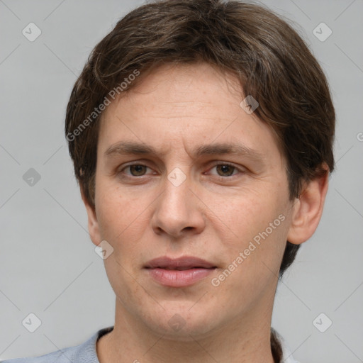 Joyful white adult male with short  brown hair and grey eyes