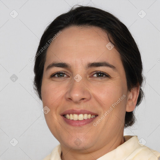 Joyful white adult female with medium  brown hair and brown eyes