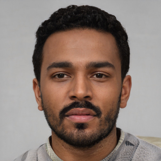 Neutral black young-adult male with short  black hair and brown eyes