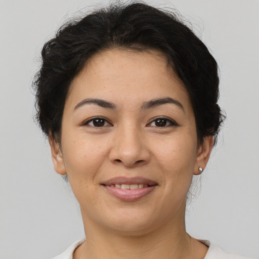 Joyful asian young-adult female with short  brown hair and brown eyes