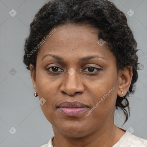 Joyful black adult female with short  brown hair and brown eyes