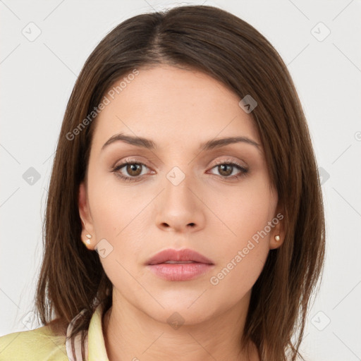 Neutral white young-adult female with long  brown hair and brown eyes