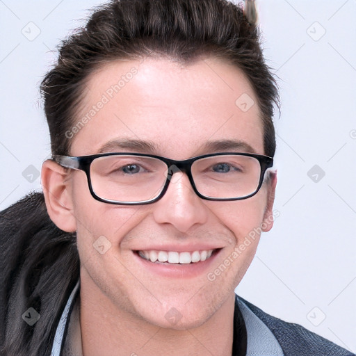 Joyful white young-adult male with short  brown hair and blue eyes