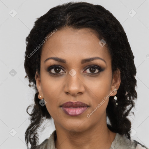 Joyful black young-adult female with long  black hair and brown eyes