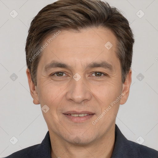 Joyful white adult male with short  brown hair and brown eyes