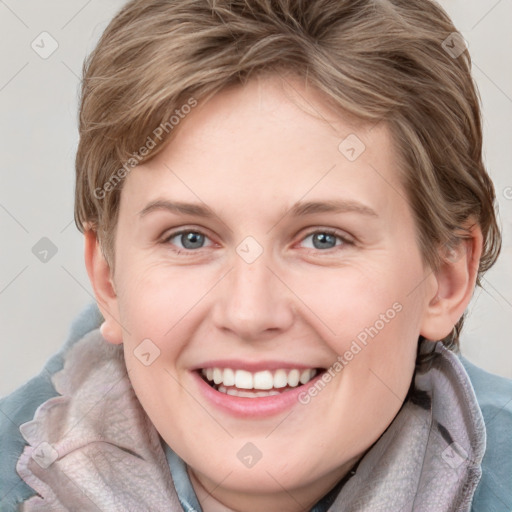 Joyful white young-adult female with medium  brown hair and blue eyes