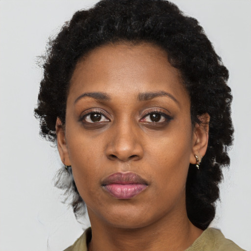 Neutral black young-adult female with long  black hair and brown eyes