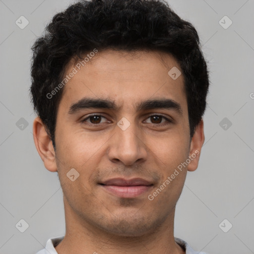 Joyful white young-adult male with short  black hair and brown eyes