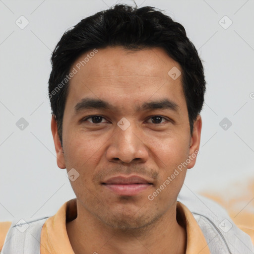 Joyful asian young-adult male with short  black hair and brown eyes