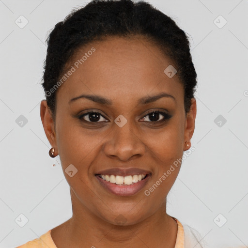 Joyful black young-adult female with short  black hair and brown eyes