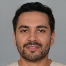 Neutral white young-adult male with short  black hair and brown eyes