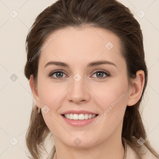 Joyful white young-adult female with long  brown hair and brown eyes