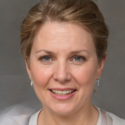 Joyful white adult female with short  brown hair and grey eyes