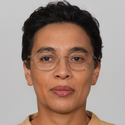 Joyful latino adult male with short  black hair and brown eyes