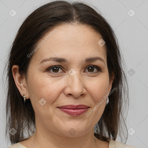 Joyful white adult female with medium  brown hair and brown eyes