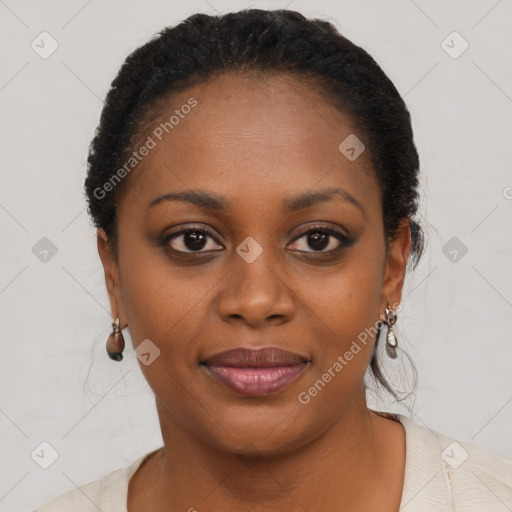 Joyful black young-adult female with short  brown hair and brown eyes