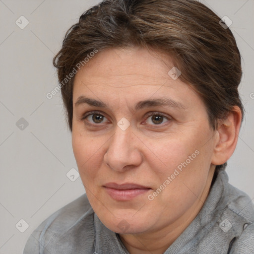 Joyful white adult female with short  brown hair and brown eyes