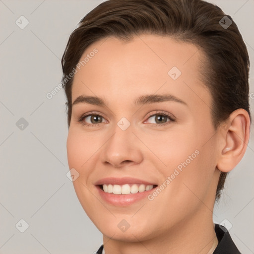 Joyful white young-adult female with medium  brown hair and brown eyes