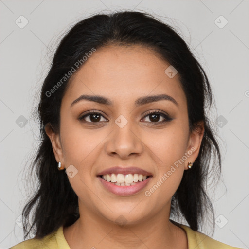 Joyful latino young-adult female with long  brown hair and brown eyes