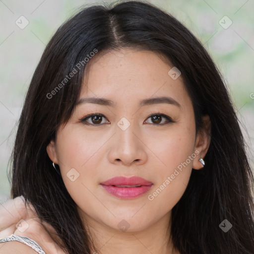Joyful asian young-adult female with long  brown hair and brown eyes