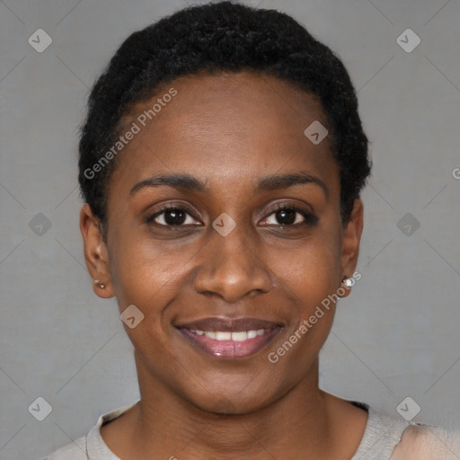 Joyful black young-adult female with short  black hair and brown eyes