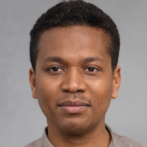 Neutral black young-adult male with short  black hair and brown eyes