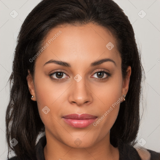 Joyful latino young-adult female with long  brown hair and brown eyes