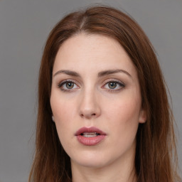 Neutral white young-adult female with long  brown hair and brown eyes