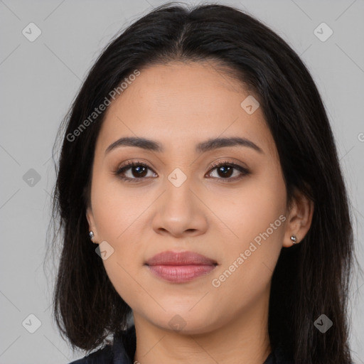 Joyful latino young-adult female with long  brown hair and brown eyes