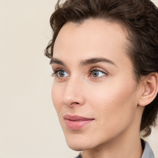 Neutral white young-adult female with medium  brown hair and brown eyes