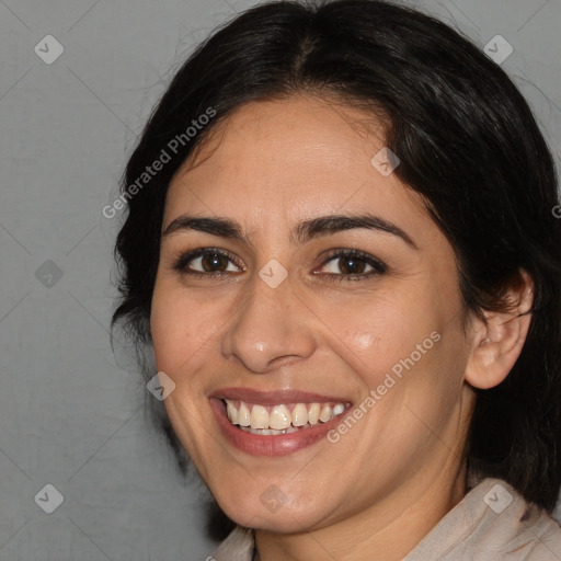 Joyful white adult female with medium  brown hair and brown eyes