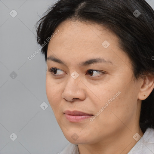 Joyful white adult female with medium  brown hair and brown eyes