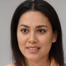 Joyful latino young-adult female with long  brown hair and brown eyes