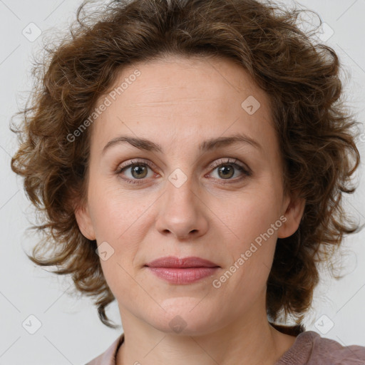 Joyful white young-adult female with medium  brown hair and green eyes